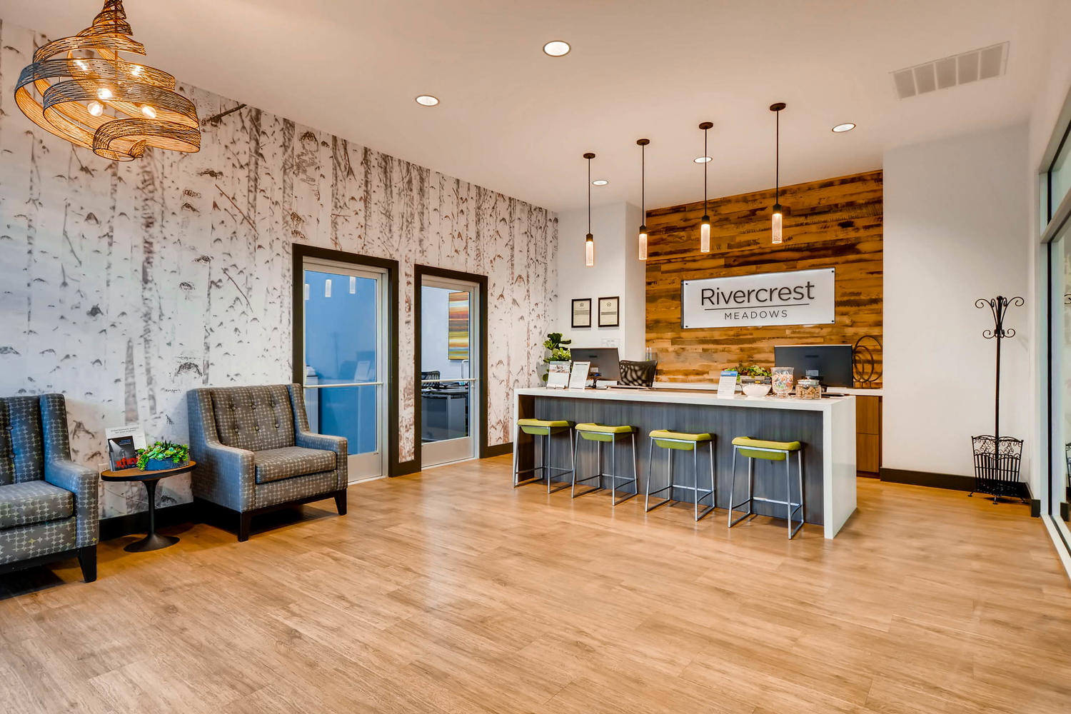 Leasing office lobby with lounge seating and reception desk