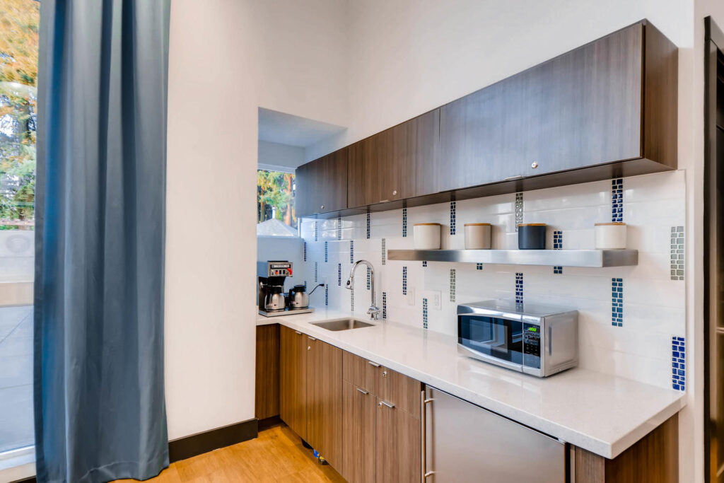 Clubhouse kitchenette with microwave, mini fridge, and coffee maker