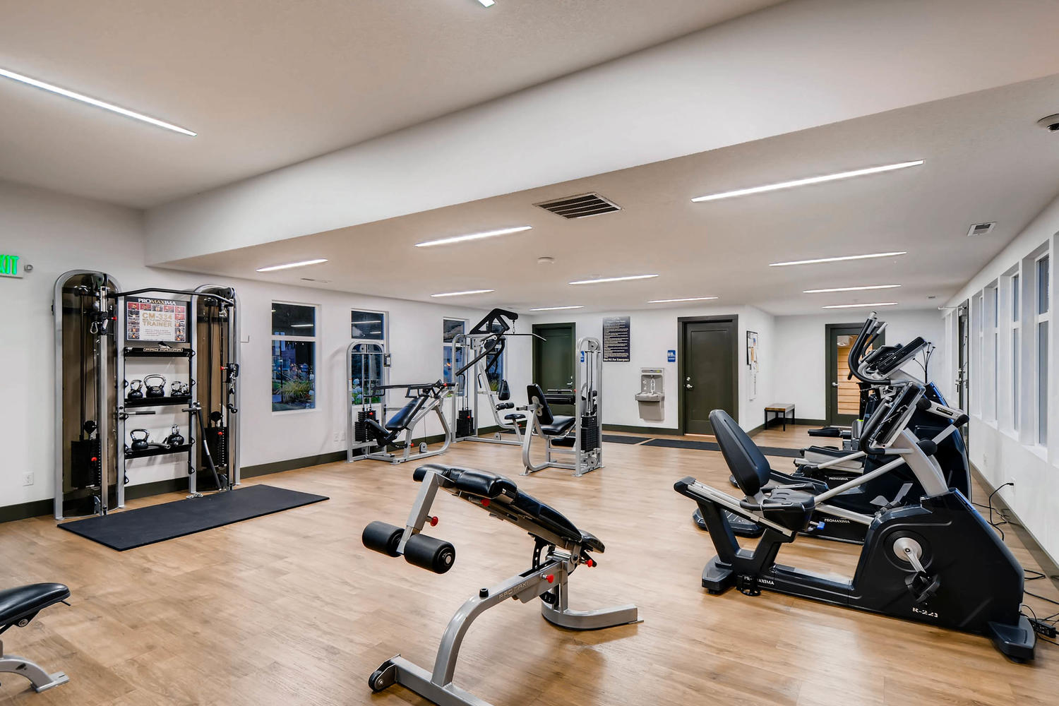 fitness center with cardio machines and strength training equipment