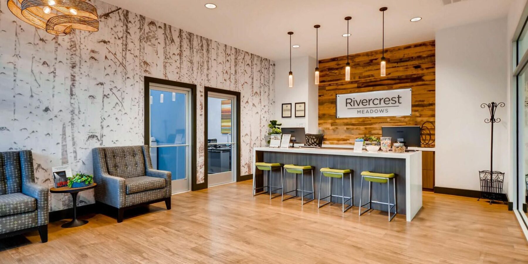 Leasing office lobby with armchairs and reception desk