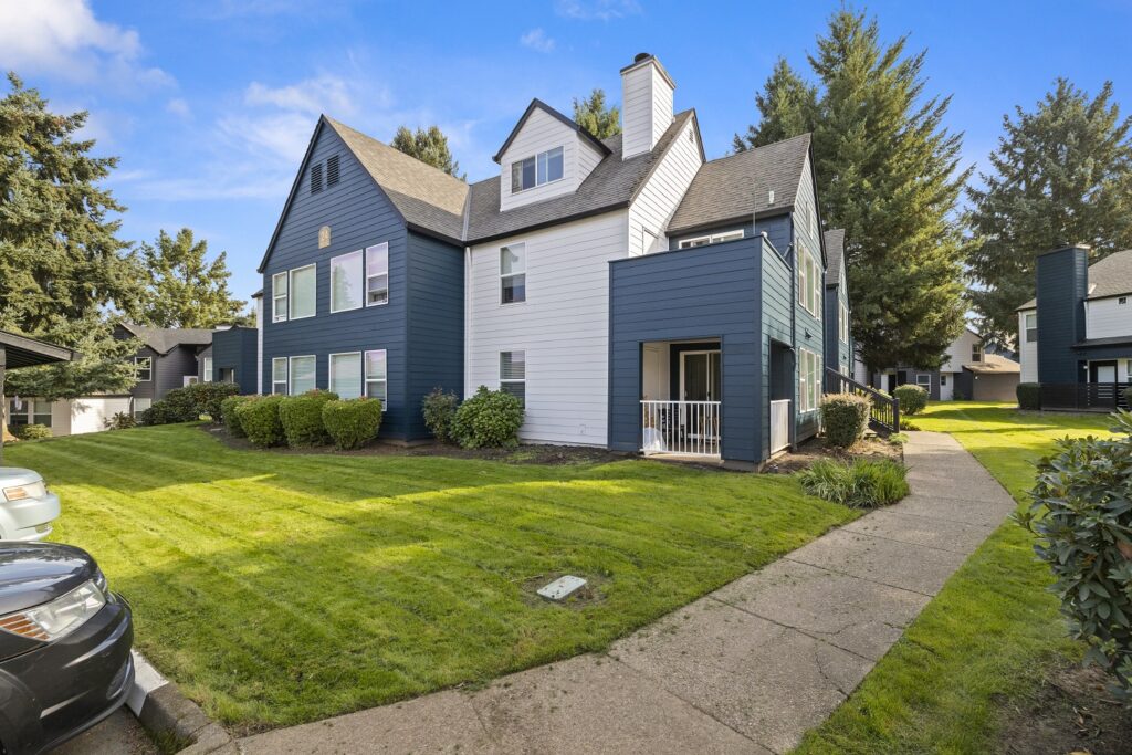 Sidewalks and grassy lawns in between residential buildings
