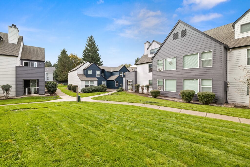 Sidewalks and grassy lawns in between residential buildings