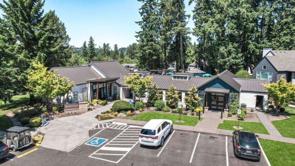 aerial exterior view of clubhouse with fitness center and parking
